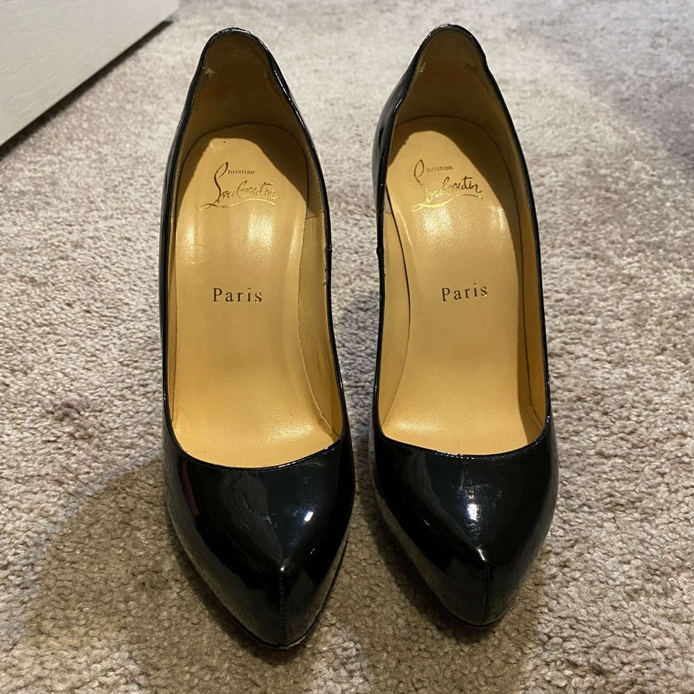 Louboutin patent leather red bottoms. Worn twice.